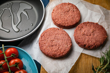 raw cutlets for burgers with greens and seeds

