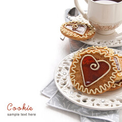 Homemade cookies with caramel in the center of the heart shaped, ornament with white chocolate