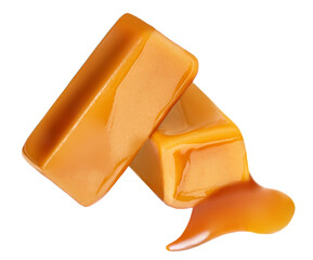 Sweet Caramel candies with caramel sauce isolated on a white background close up.
