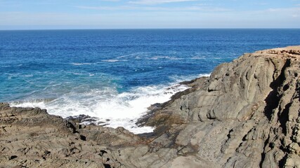 The sea hits the cliffs