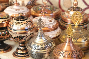 Fototapeta na wymiar Turkish copper bowls handmade patterned from Gaziantep,Turkey