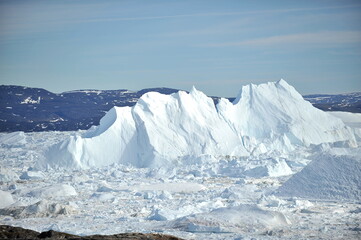 Greenland. Icebergs. Giant floating Iceberg from melting glacier. Global Warming and Climate Change.