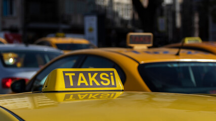 Close up of Istanbul taxi. Many taxis on street. The word 
