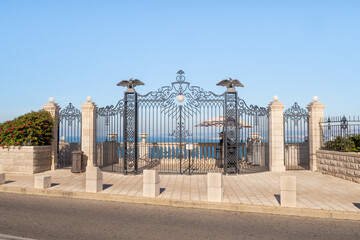 Decorative metal entrance gate on the upper terrace of the Bahai Garden in Haifa city, Israel