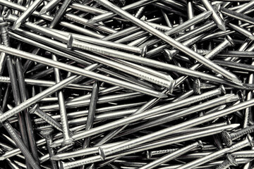 Pile of metal nails as background, closeup