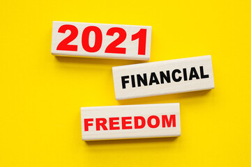 words 2021 FINANCIAL FREEDOM written on ON A YELLOW BACKGROUND . You can use in business, marketing and other concepts.