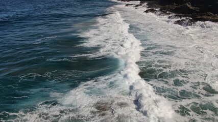 The sea hits the cliffs