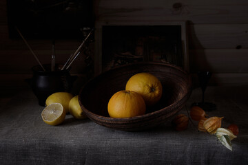 Citrus fruits on the table in ceramic dishes.