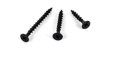 Three different length screws for a cross-shaped screwdriver. Isolated on white background.