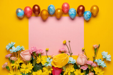 Easter background with Easter eggs and spring flowers.