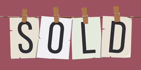 Word "Sold" attached to the rope with hairpins