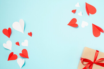 Background for Valentine's Day. Hearts, box, multicolored. Blue background with place for text.
Celebrating Valentine's Day.