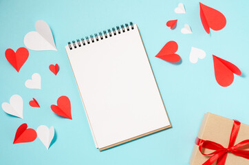 Background for Valentine's Day. Hearts, box, multicolored. Blue background with place for text.
Celebrating Valentine's Day.