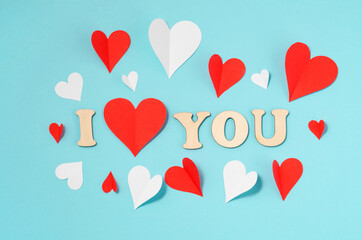 Background for Valentine's Day. Hearts are multicolored. The inscription "I love you". Blue background with place for text.
Celebrating Valentine's Day.