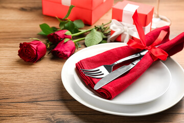 Beautiful table setting for Valentine's Day dinner on wooden background, closeup