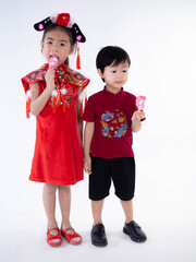 Happy Chinese new year. Asian boy and girl in cheongsam of traditional chinese dress on white background.