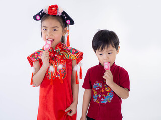 Happy Chinese new year. Asian boy and girl in cheongsam of traditional chinese dress on white background.