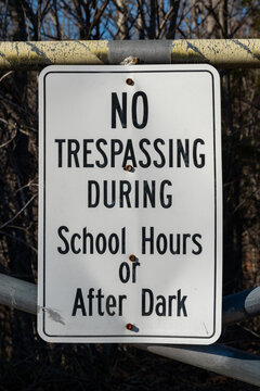 No trespassing during school hours or after dark sign