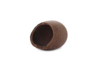 Broken milk chocolate egg on white background
