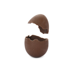 Broken milk chocolate egg on white background