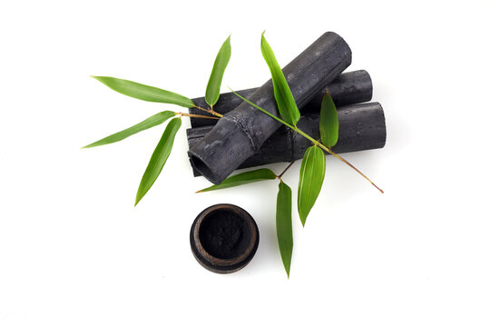 Natural Bamboo ativated charcoal and powder isolated on white background