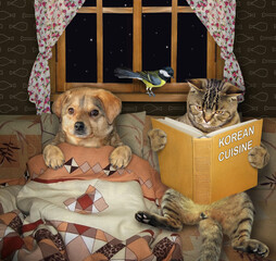A cat reads a bedtime story to a dog covered with a blanket in bed at home at night. The story is...
