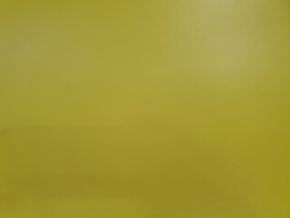 A landscape photo of a yellow vintage style wall or yellow paper is perfect as a background or as a text filler.
