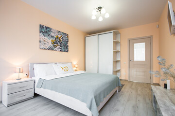 Interior photography, large bedroom with large bed, and TV in a modern style