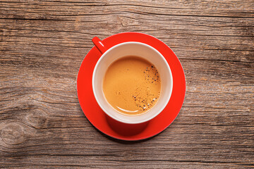 Cup with coffee on a wooden table. Coffee drink.