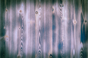 Old wooden background with purple horizontal boards.
