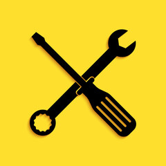 Black Spanner and screwdriver tools icon isolated on yellow background. Service tool symbol. Long shadow style. Vector.