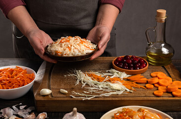Ingredients for home-made vegetable canning in the kitchen. Sauerkraut. Healthy organic fermented food.