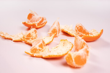 a few slices of tangerine among the peels