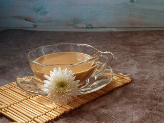 glass of creamy coffee on bamboo  mat