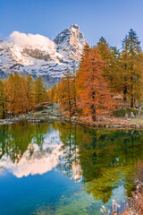 Blue Lake and the surroundings area during the fall and changing of the colors. Foliage, reflection and snowy peaks.