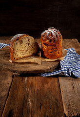 Easter cake kraffin. Kraffins with raisins, candied fruits and poppy seeds, sprinkled with powdered sugar. Close-up of homemade cake. Cruffin. Red colored eggs.