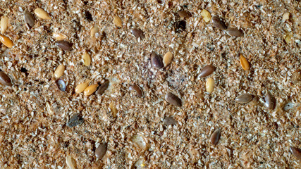 Close-up background of crispy crispbreads. Healthy Snacks: Crunchy Flakes, Multigrain Flakes, Flaxseed, Sesame, Sunflower Seed Protein Bar.