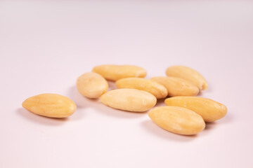nine peeled almonds side view
