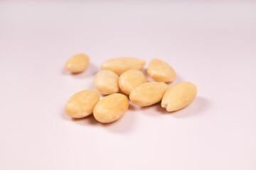 nine peeled almonds in the center of the frame side view