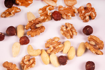 hazelnuts, cashews, walnuts and almonds are mixed with each other