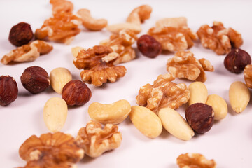 hazelnuts, cashews, walnuts and almonds mixed together side view