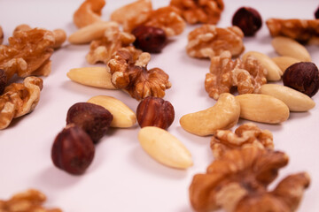 hazelnuts, cashews, walnuts and almonds mixed in front view