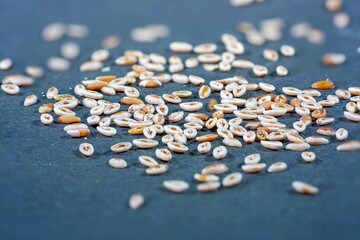 Indian flea seeds photographed in the studio against a black background