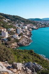 Naklejka premium Beautiful colorful cityscape on the mountains over Adriatic sea, Europe, coastal city Dobre Vode on the cliffs, Montenegro.