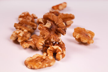 several peeled walnuts are in a pile