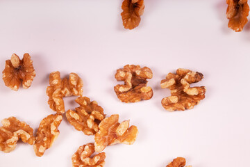 walnuts are peeled and randomly arranged around the frame