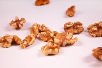 walnuts are peeled and placed randomly around the frame angled view
