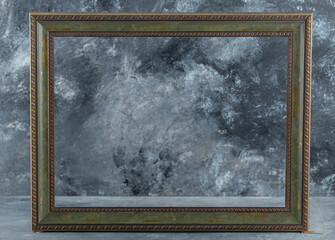 Wooden empty picture frame on marble background