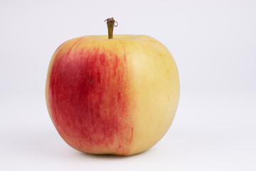apple with the left half red and the right white close-up