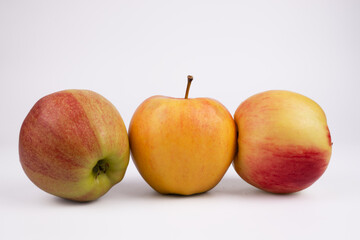 three different apples lie close to each other